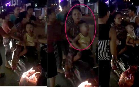 Người phụ nữ bị gia đình chị Thanh bắt giữ khi đang bế cháu bé trên tay.