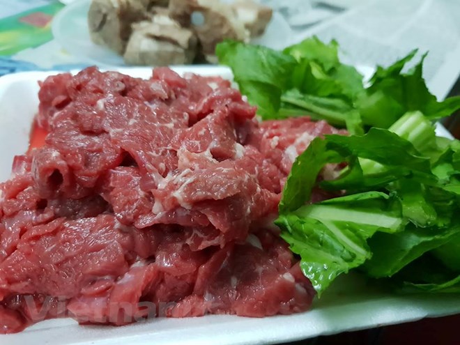 Nhu cầu về nhiều loại thực phẩm tăng cao trong dịp Tết. (Ảnh: T.G/Vietnam+)