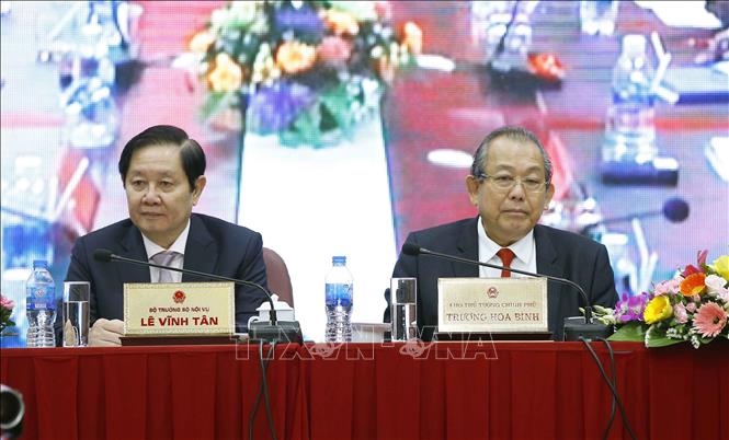 Phó Thủ tướng Thường trực Chính phủ Trương Hòa Bình và Bộ trưởng Bộ Nội vụ Lê Vĩnh Tân chủ trì hội nghị. Ảnh: Doãn Tấn/TTXVN